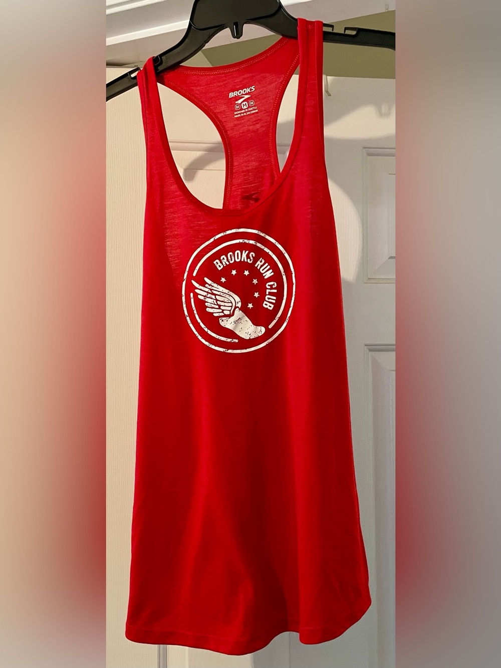 Size medium Brooks Run Club razor back tank top.